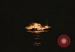 Image of A ship in flames at night Pacific Ocean, 1945, second 56 stock footage video 65675075997