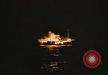 Image of A ship in flames at night Pacific Ocean, 1945, second 57 stock footage video 65675075997