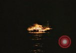 Image of A ship in flames at night Pacific Ocean, 1945, second 58 stock footage video 65675075997