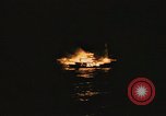 Image of A ship in flames at night Pacific Ocean, 1945, second 59 stock footage video 65675075997