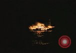 Image of A ship in flames at night Pacific Ocean, 1945, second 60 stock footage video 65675075997