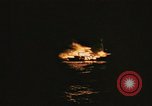 Image of A ship in flames at night Pacific Ocean, 1945, second 61 stock footage video 65675075997