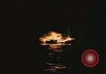 Image of A ship in flames at night Pacific Ocean, 1945, second 62 stock footage video 65675075997