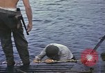 Image of US Sailors leave submarine and go ashore in life raft Japan, 1945, second 3 stock footage video 65675076035