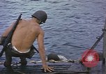 Image of US Sailors leave submarine and go ashore in life raft Japan, 1945, second 4 stock footage video 65675076035