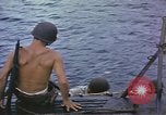 Image of US Sailors leave submarine and go ashore in life raft Japan, 1945, second 5 stock footage video 65675076035