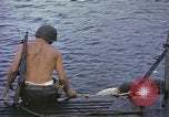 Image of US Sailors leave submarine and go ashore in life raft Japan, 1945, second 6 stock footage video 65675076035