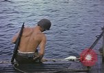 Image of US Sailors leave submarine and go ashore in life raft Japan, 1945, second 7 stock footage video 65675076035