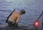 Image of US Sailors leave submarine and go ashore in life raft Japan, 1945, second 8 stock footage video 65675076035