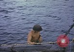 Image of US Sailors leave submarine and go ashore in life raft Japan, 1945, second 9 stock footage video 65675076035