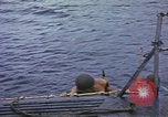Image of US Sailors leave submarine and go ashore in life raft Japan, 1945, second 11 stock footage video 65675076035