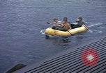 Image of US Sailors leave submarine and go ashore in life raft Japan, 1945, second 12 stock footage video 65675076035