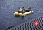Image of US Sailors leave submarine and go ashore in life raft Japan, 1945, second 13 stock footage video 65675076035