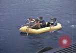 Image of US Sailors leave submarine and go ashore in life raft Japan, 1945, second 15 stock footage video 65675076035