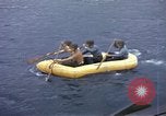 Image of US Sailors leave submarine and go ashore in life raft Japan, 1945, second 16 stock footage video 65675076035