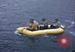 Image of US Sailors leave submarine and go ashore in life raft Japan, 1945, second 17 stock footage video 65675076035