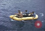 Image of US Sailors leave submarine and go ashore in life raft Japan, 1945, second 18 stock footage video 65675076035