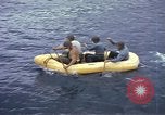 Image of US Sailors leave submarine and go ashore in life raft Japan, 1945, second 19 stock footage video 65675076035