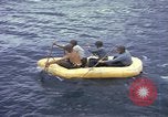 Image of US Sailors leave submarine and go ashore in life raft Japan, 1945, second 20 stock footage video 65675076035