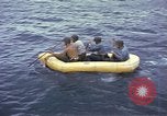 Image of US Sailors leave submarine and go ashore in life raft Japan, 1945, second 21 stock footage video 65675076035