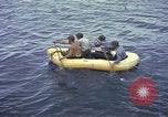 Image of US Sailors leave submarine and go ashore in life raft Japan, 1945, second 23 stock footage video 65675076035
