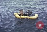 Image of US Sailors leave submarine and go ashore in life raft Japan, 1945, second 24 stock footage video 65675076035