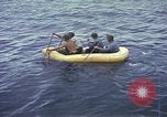 Image of US Sailors leave submarine and go ashore in life raft Japan, 1945, second 25 stock footage video 65675076035