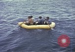Image of US Sailors leave submarine and go ashore in life raft Japan, 1945, second 26 stock footage video 65675076035