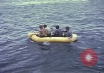 Image of US Sailors leave submarine and go ashore in life raft Japan, 1945, second 27 stock footage video 65675076035