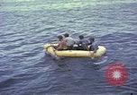 Image of US Sailors leave submarine and go ashore in life raft Japan, 1945, second 28 stock footage video 65675076035