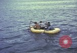 Image of US Sailors leave submarine and go ashore in life raft Japan, 1945, second 30 stock footage video 65675076035