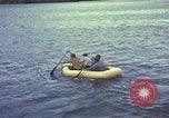 Image of US Sailors leave submarine and go ashore in life raft Japan, 1945, second 31 stock footage video 65675076035