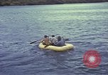 Image of US Sailors leave submarine and go ashore in life raft Japan, 1945, second 32 stock footage video 65675076035