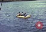 Image of US Sailors leave submarine and go ashore in life raft Japan, 1945, second 34 stock footage video 65675076035