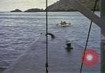 Image of US Sailors leave submarine and go ashore in life raft Japan, 1945, second 36 stock footage video 65675076035