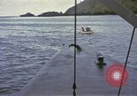 Image of US Sailors leave submarine and go ashore in life raft Japan, 1945, second 39 stock footage video 65675076035