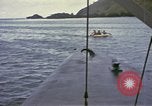 Image of US Sailors leave submarine and go ashore in life raft Japan, 1945, second 40 stock footage video 65675076035