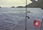 Image of US Sailors leave submarine and go ashore in life raft Japan, 1945, second 44 stock footage video 65675076035