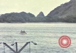 Image of US Sailors leave submarine and go ashore in life raft Japan, 1945, second 47 stock footage video 65675076035