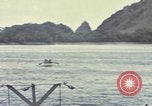 Image of US Sailors leave submarine and go ashore in life raft Japan, 1945, second 48 stock footage video 65675076035