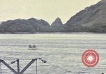 Image of US Sailors leave submarine and go ashore in life raft Japan, 1945, second 50 stock footage video 65675076035