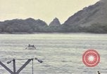 Image of US Sailors leave submarine and go ashore in life raft Japan, 1945, second 51 stock footage video 65675076035