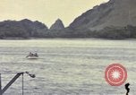 Image of US Sailors leave submarine and go ashore in life raft Japan, 1945, second 55 stock footage video 65675076035