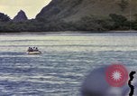 Image of US Sailors leave submarine and go ashore in life raft Japan, 1945, second 62 stock footage video 65675076035