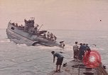 Image of USS Cod rescuing sailors from dutch submarine, O-19 Pacific Ocean, 1945, second 16 stock footage video 65675076084
