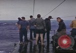 Image of USS Cod rescuing sailors from dutch submarine, O-19 Pacific Ocean, 1945, second 24 stock footage video 65675076084
