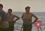 Image of USS Cod rescuing sailors from dutch submarine, O-19 Pacific Ocean, 1945, second 29 stock footage video 65675076084