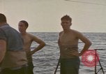 Image of USS Cod rescuing sailors from dutch submarine, O-19 Pacific Ocean, 1945, second 30 stock footage video 65675076084