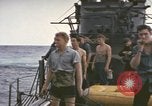 Image of USS Cod rescuing sailors from dutch submarine, O-19 Pacific Ocean, 1945, second 59 stock footage video 65675076084