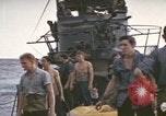 Image of USS Cod rescuing sailors from dutch submarine, O-19 Pacific Ocean, 1945, second 62 stock footage video 65675076084